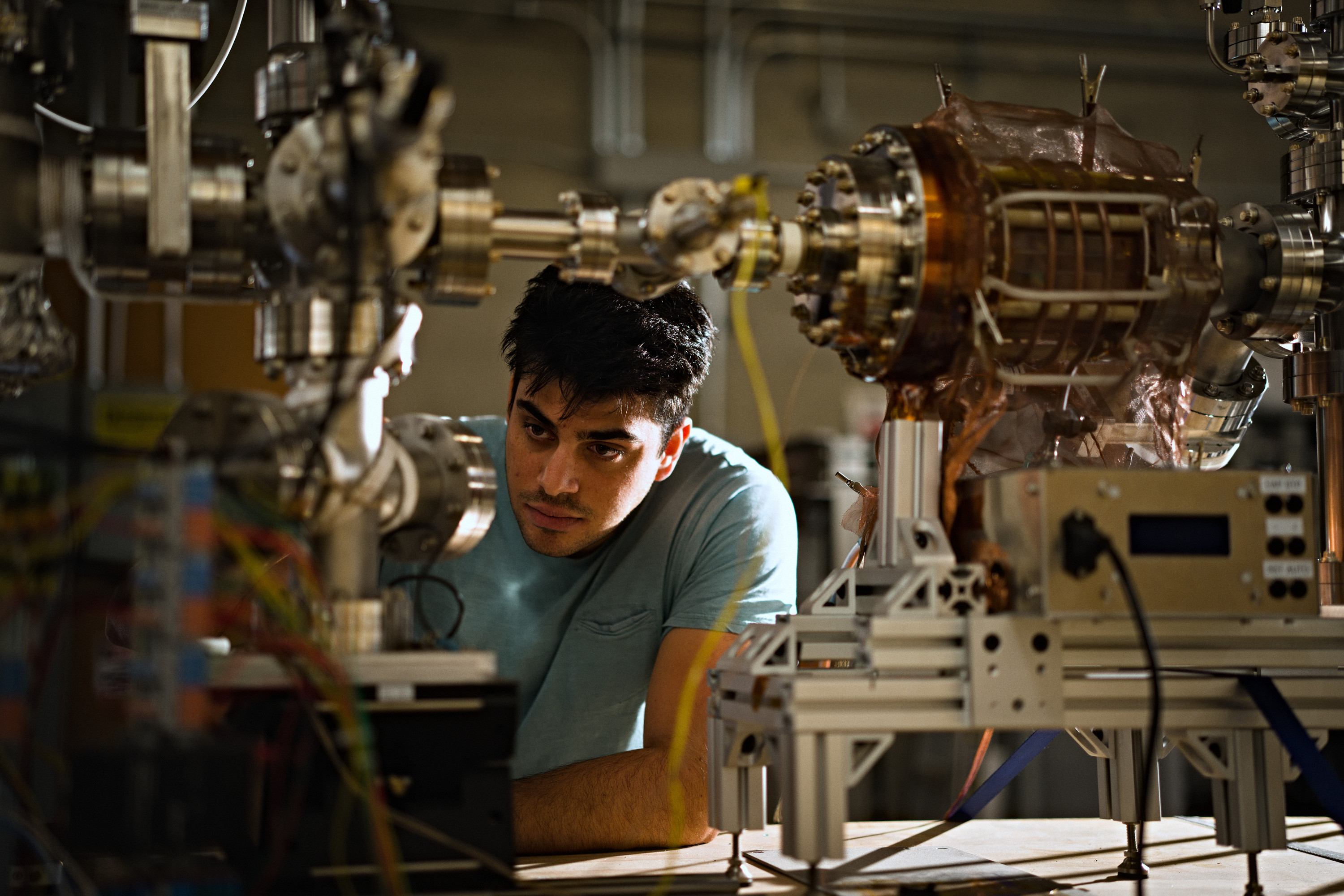 A Marathon researcher working beside the fusion reactor’s vacuum equipment